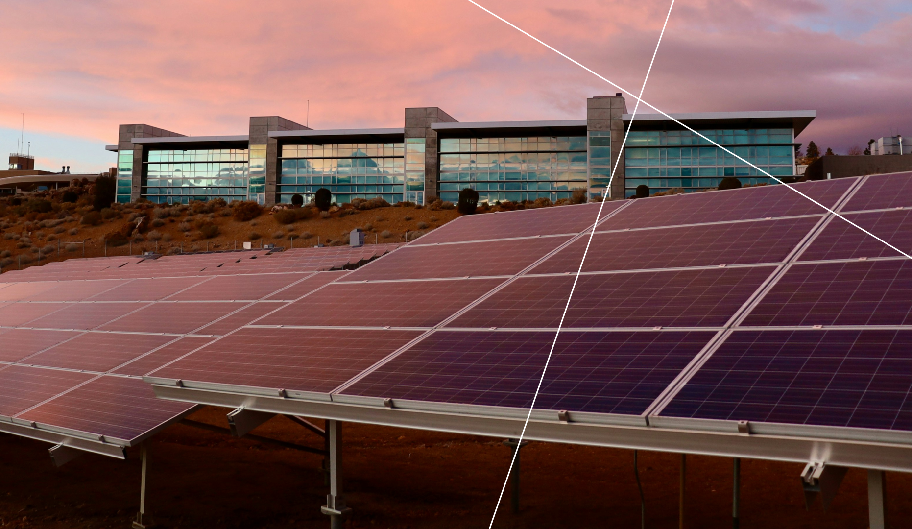 Solar panels in front of a modern glass building at sunset — a representation of renewable energy in smart city infrastructure